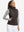 Front upper body of model wearing women's lightweight slim-fit puffer vest, sleek fit in coffee brown