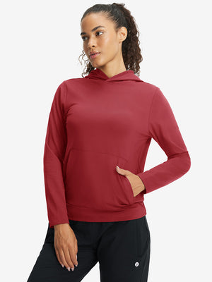 Model with one hand in side pocket wearing women's lightweight hoodies pullover in red.