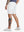 Back lower-body view of model in WHITE Water Resistant Versatile 8 Pockets Shorts.
