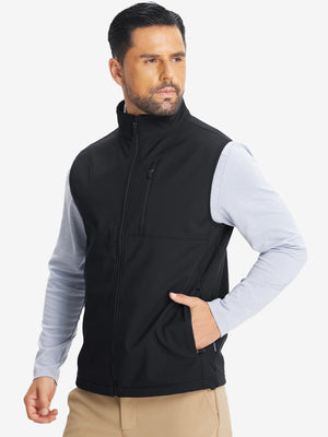Model front half-body shot with one hand in pocket wearing sleeveless softshell fleece outdoor vests with 6 pockets in black