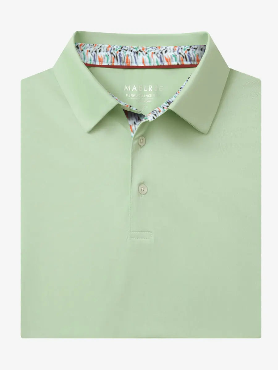 Folded Canary Green Everyday Classic Solid Polo neatly laid out for display