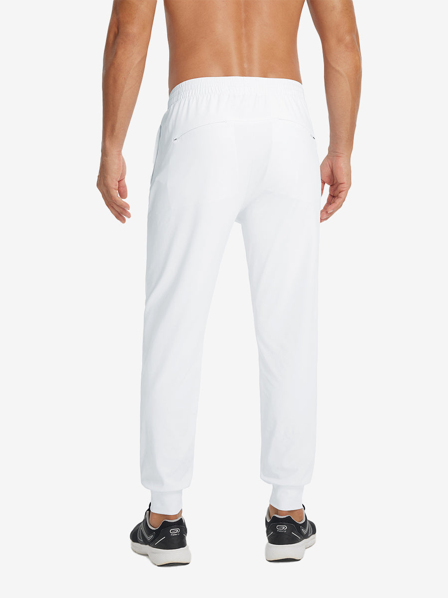 Back lower-body view showing lightweight traning track pants on model in white.
