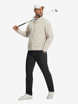 Model holding a golf club, wearing lightweight flat front casual trousers in black, full-body view.