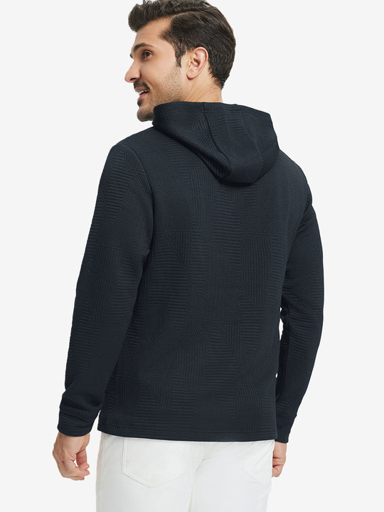 Back view of model wearing texture solid hoodies pullover showing fit and hood detail, navy.