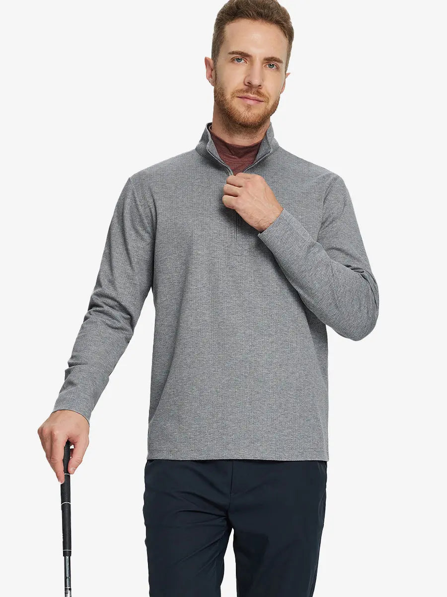 Half-body front view of model holding golf club wearing SMOKY GRAY HERRINGBONE Premium Jacquard Quarter Zip Pullover.								
