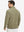 Back upper view of model in midweight warm stretchy quarter zip pullover, highlighting shoulder fit in desert yellow.
