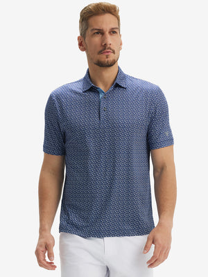 Male model front upper body wearing Performance quick dry print golf polos, sleek navy white floral look