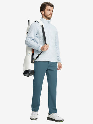 Full body model with bag, wearing water-resistant fleece lined pants in saxony blue outdoors