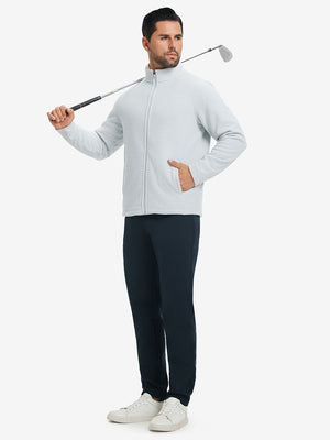 Model carrying a golf club on shoulder, wearing navy lightweight moisture wicking dress pants.