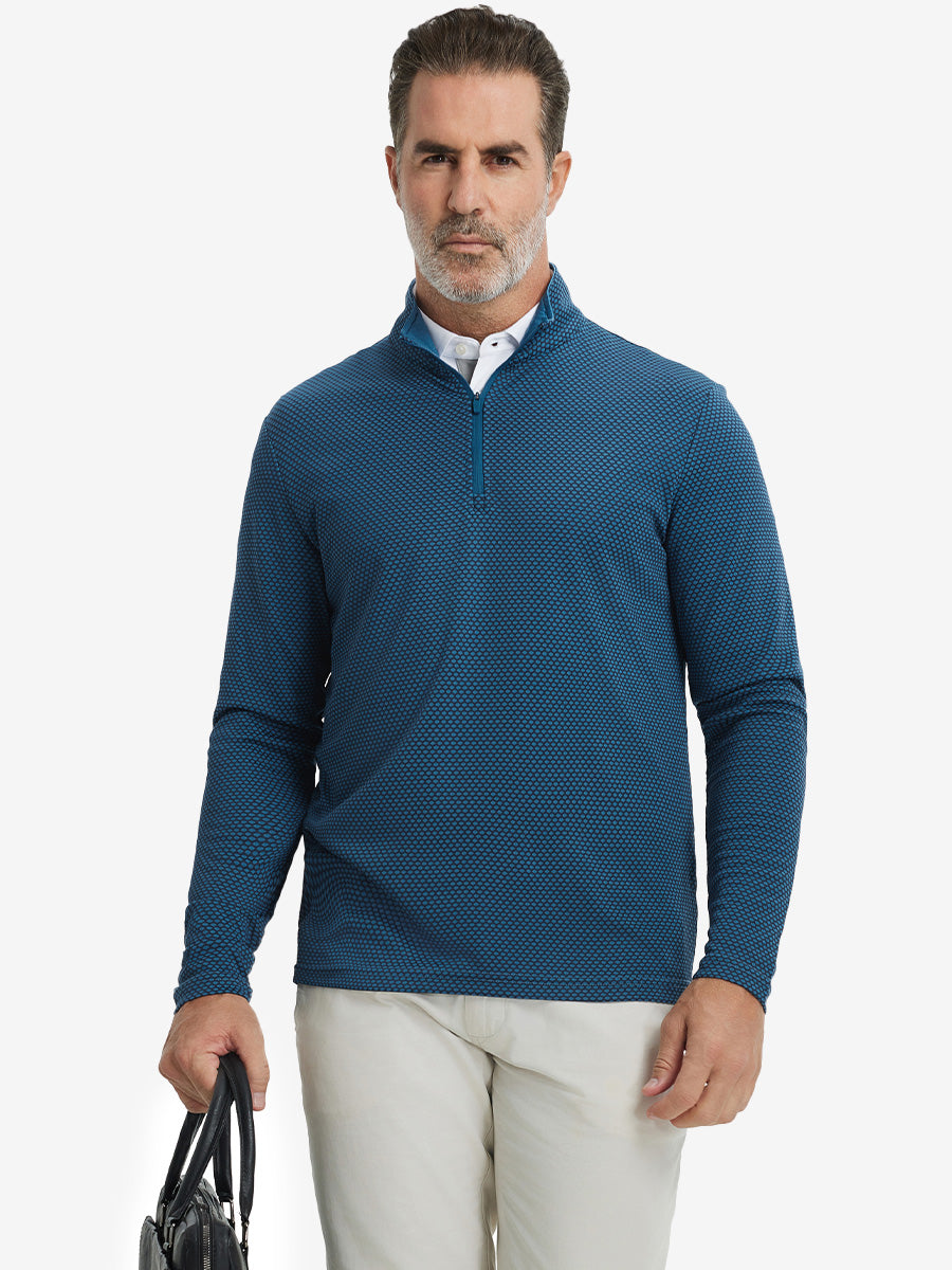 Model carrying a bag in jacquard quarter zip pullover in navy/blue, blending comfort and style.