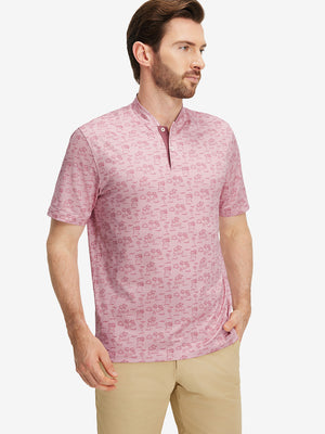 Front half-body of model in pink beach palm stretch printed collarless henley golf shirts