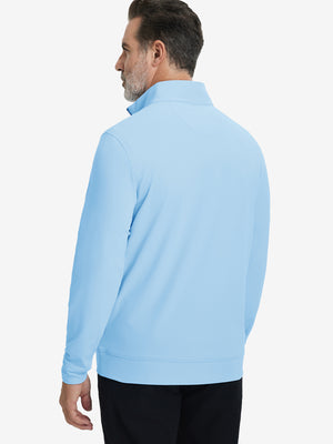 Back upper body view of the light blue lightweight golf pullover, model turns head slightly with ease.
