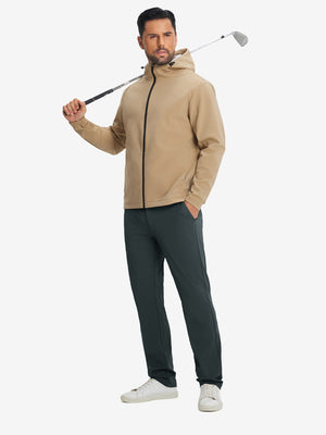 Model holding a golf club, wearing soft lightweight casual golf pants with 5 pockets in dark grey.