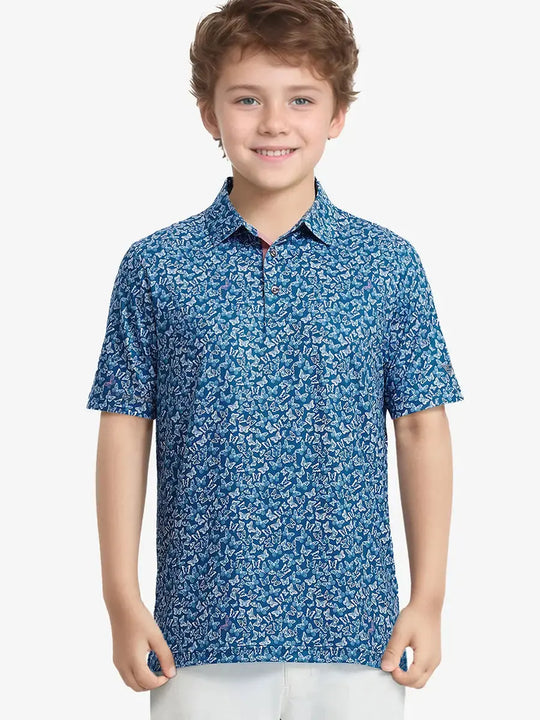 Boy posing in BLUE WHITE BUTTERFLY golf polo mid-swing holding a club confidently
