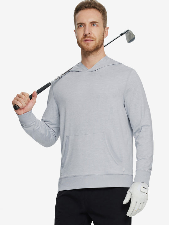Model holding a golf club, dressed in the Brick Heather Athletic Golf Hoodie with a sleek fit.