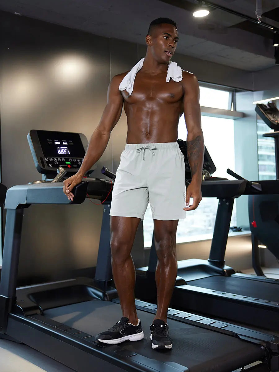 Full-body gym view of model in GLACIER GREY 2 in 1 Running Sports Shorts with Liner