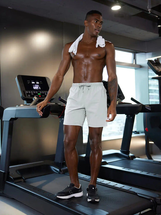 Full-body gym view of model in GLACIER GREY 2 in 1 Running Sports Shorts with Liner