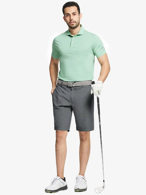 Full body front view of model wearing DARK GREY 9 Inch Heather Performance Golf Shorts, holding a golf club