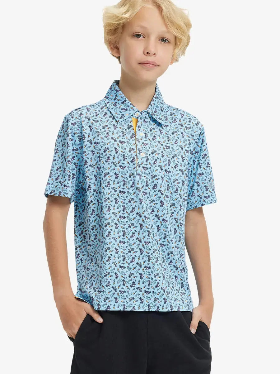 Front half-body shot of boy model in BLUE TRIATHLON Performance Print Boys Golf Polo, ready to play