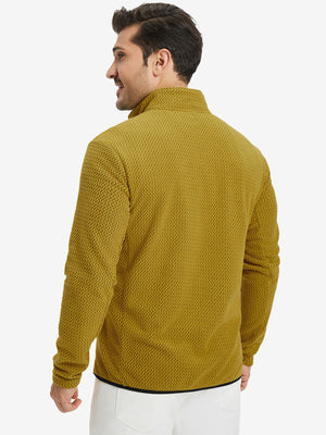 Back upper view of model in midweight warm stretchy quarter zip pullover, highlighting shoulder fit in yellow.