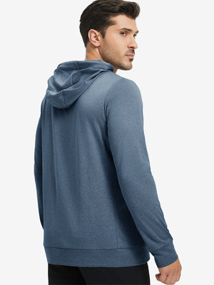 Back upper body view of the navy melange classic heather hoodie, model turns head slightly with ease.