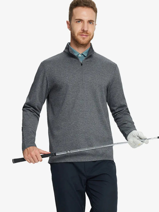 Half-body front view of model holding golf club wearing DARK GRAY HERRINGBONE Premium Jacquard Quarter Zip Pullover.								

