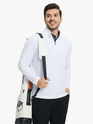 Model carrying golf bag in Premium jacquard quarter zip pullover with versatile white