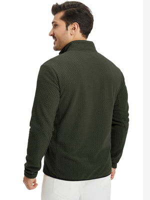 Back upper view of model in midweight warm stretchy quarter zip pullover, highlighting shoulder fit in forest green.