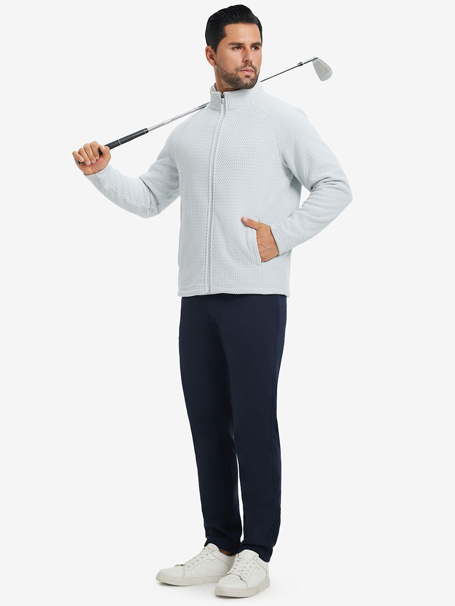 Model in dark blue top holding golf club on shoulder wearing lightweight moisture wicking dress pants in navy.