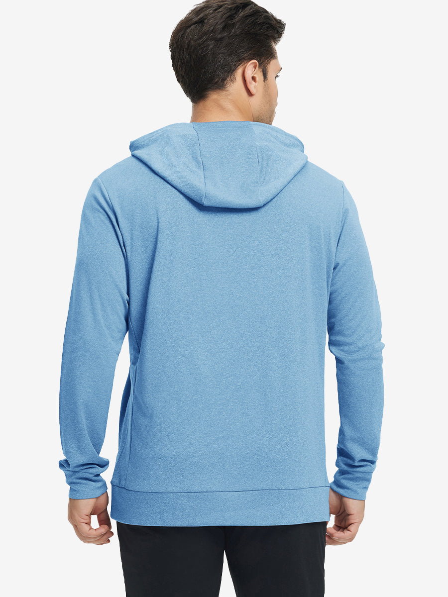 Back upper body view of the light blue melange classic heather hoodie, model turns head slightly with ease.