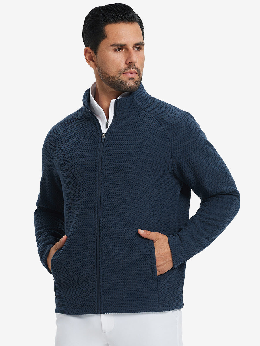 Model with both hands in pockets, wearing soft winter fleece jackets in navy, warm and relaxed.