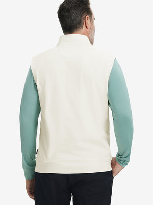 Back upper body view of the cream print collar quarter zip golf vest, clean cut and relaxed posture.