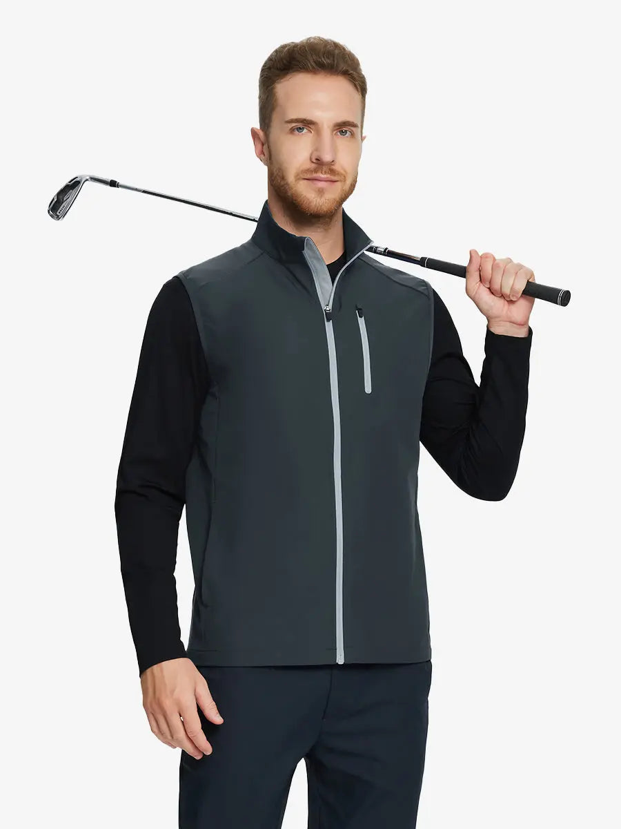 showcasing the dark grey windproof golf vest, holding a golf club, highlighting its modern design and zippered pockets.