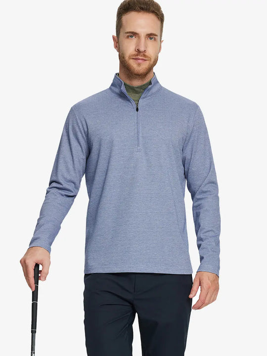 Half-body front view of model holding golf club wearing BLUE HOUNDSTOOTH Premium Jacquard Quarter Zip Pullover.								
