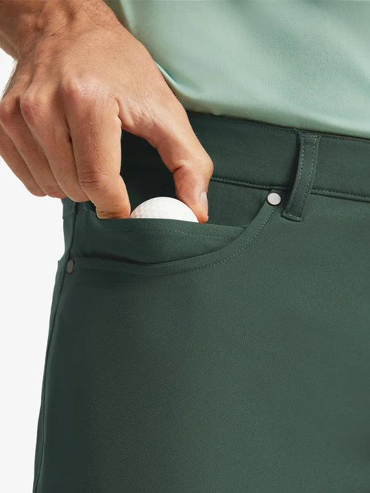 OLIVE GREEN 4-way Stretch Performance Solid Shorts, front pocket holding golf ball detail, 9 Inch