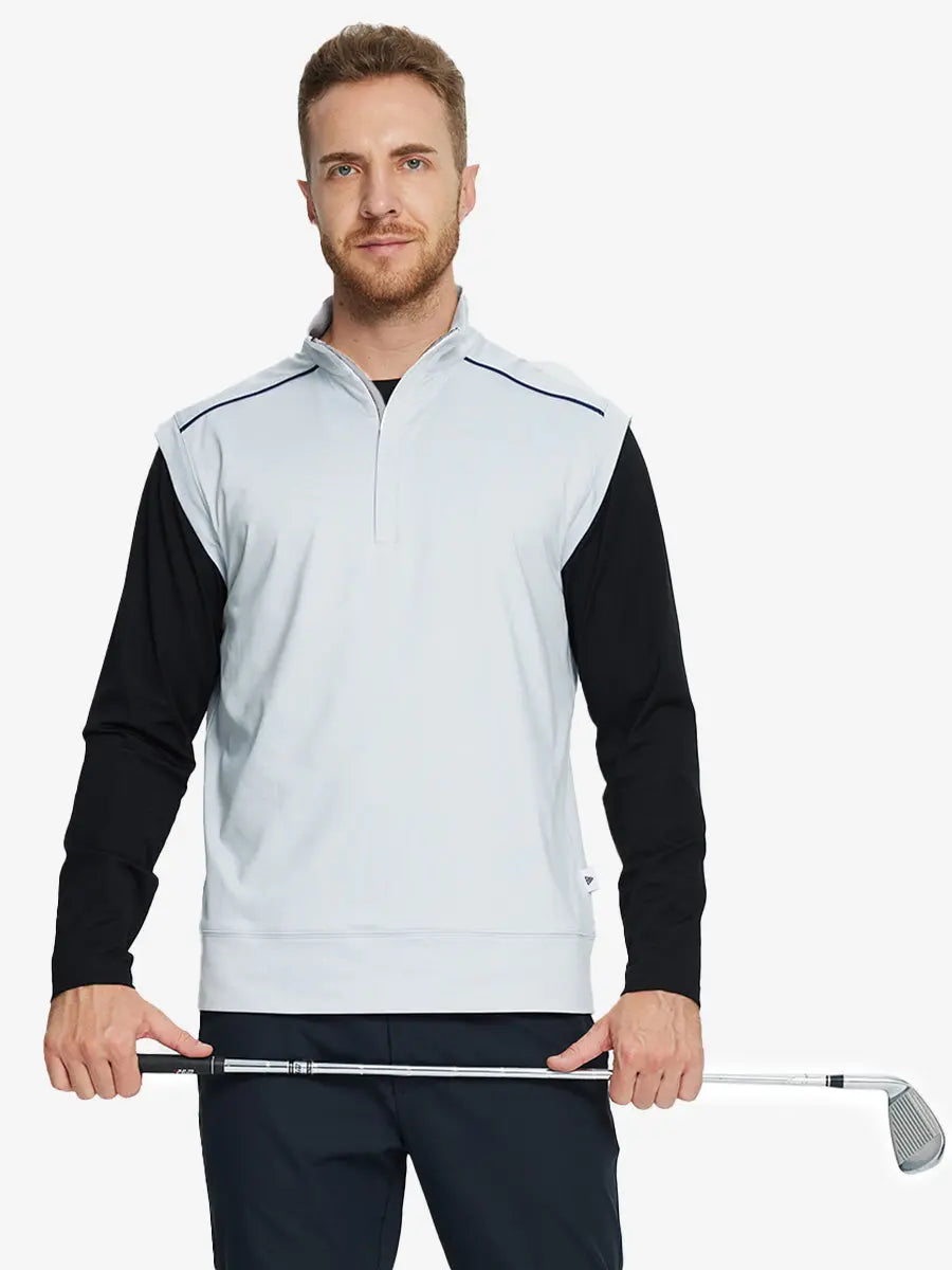 Half-body front view of model holding golf club wearing GREY MIST Stretch Solid Fleece Quarter-Zip Vest.								
