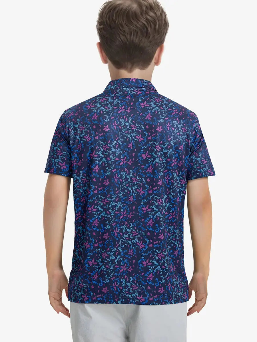 Back half-body view of boy wearing NAVY COLORFUL FLOWER Performance Print Boys Golf Polo outdoors