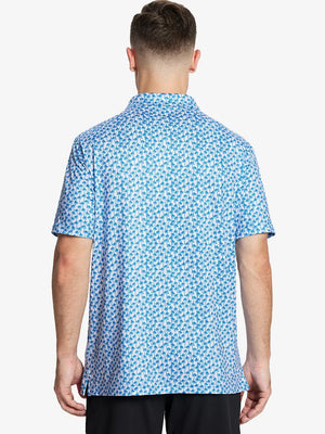 From the back, the model shows the back design of the WHITE PALM Polo shirt, clearly showing the shape and cut of the garment