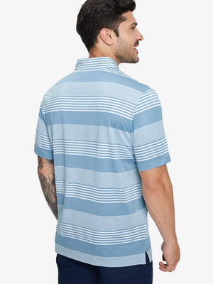 Back half-body view of model in BLUE WHITE STRIPE Performance Yarn Dye Striped Polo