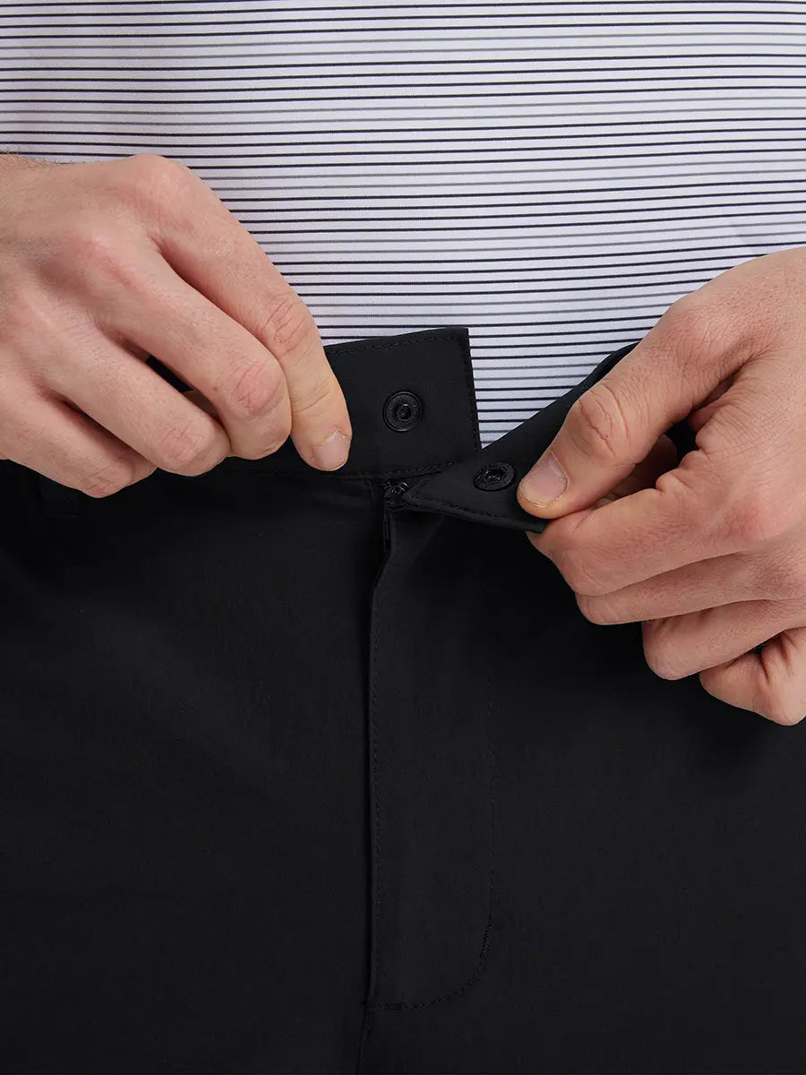 Close-up of front waistband button on pants in BLACK，highlighting detailed design.