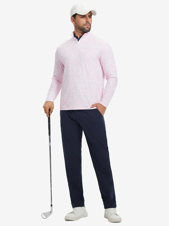 Full-body shot of model holding golf club, dressed in full print quarter zip pullover in pink artichoke.