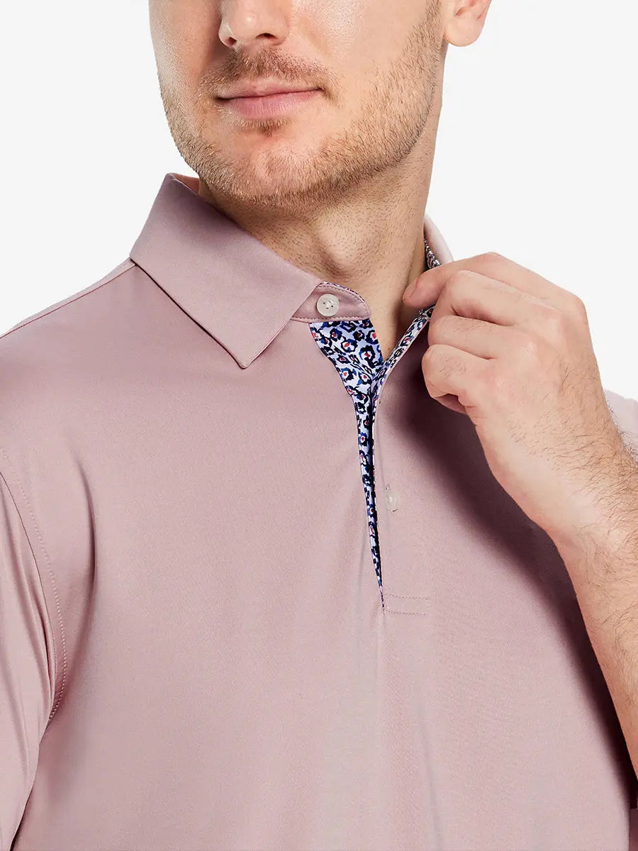 Male model wearing the Pale Pink Everyday Classic Solid Polo, front view from nose to chest
