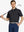 Model holding golf club, front half-body in BLACK Elegant Performance Jacquard Polo