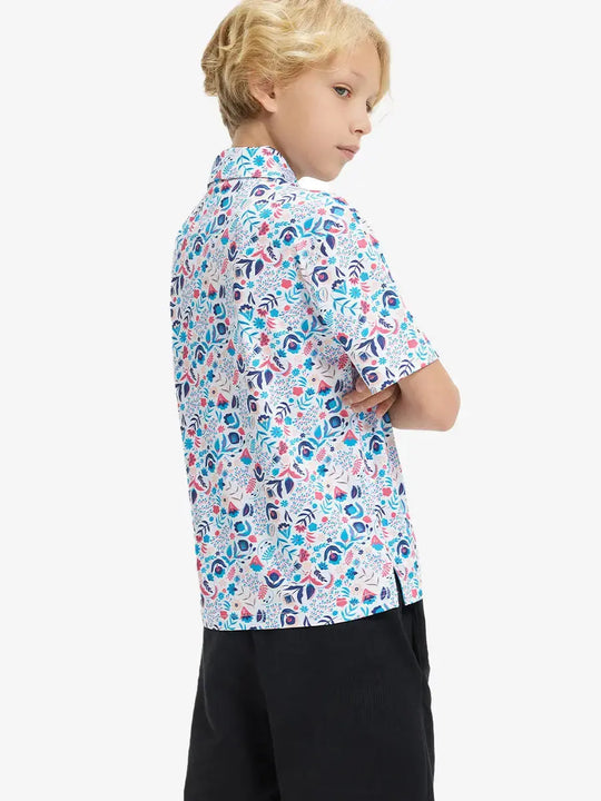 Back half-body view of boy wearing COLORFUL PLANTS Performance Print Boys Golf Polo outdoors