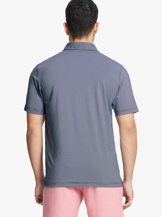 Back half-body view of NAVY STRIPE Pinstripe Jersey Performance Polo worn by model								
