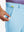 Hand placing a golf ball into pocket of water-resistant golf stretch nylon pants in light blue.