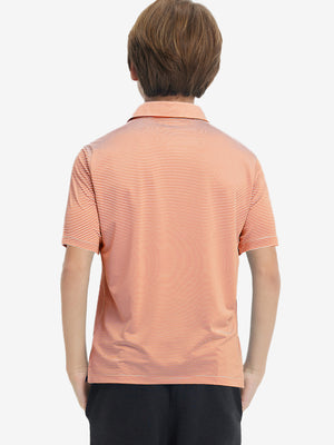 Back half-body view of youth wearing orange stripe performance cooling polo, showing rear design