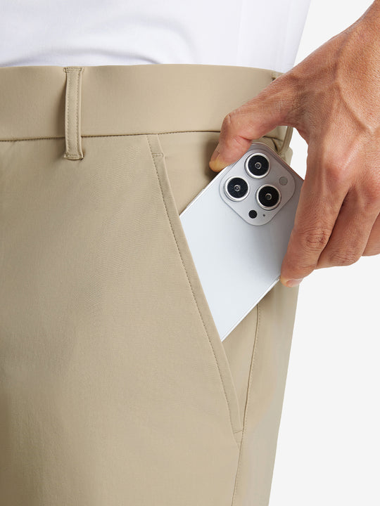 iPhone placed inside pocket of the Khaki Quick Dry Casual Shorts, showing storage space.