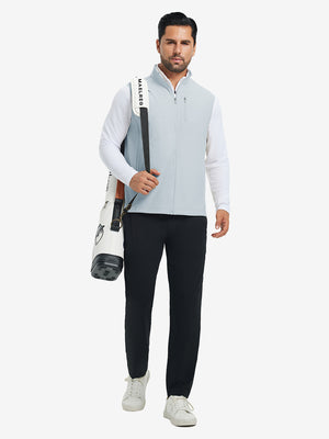 Lifestyle shots of water-resistant fleece golf vests in misty grey, worn while holding golf bag