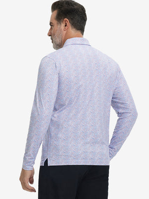 Back upper body view of the lightweight print polo in colourful hexagon, model turns slightly with relaxed pose.